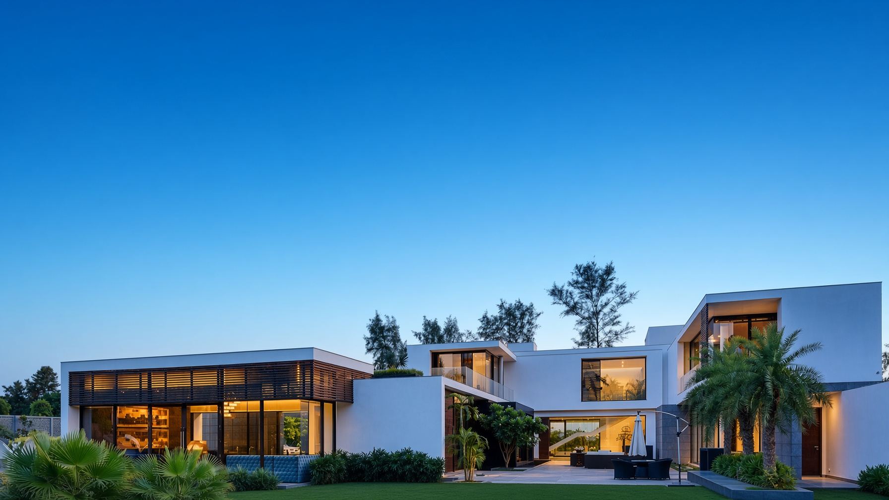 A private modernist farmhouse in South Delhi at dusk