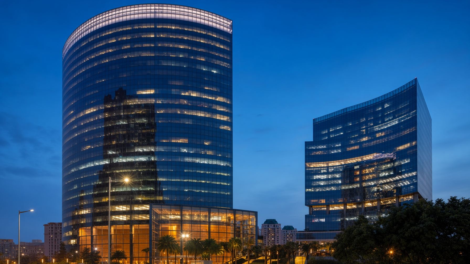 Grade-A commercial towers on Golf Course Road, Gurugram, at blue hour